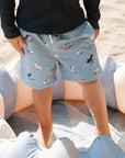 Surfing Pups Print on Blue Swim Trunks