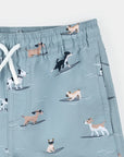 Surfing Pups Print on Blue Swim Trunks